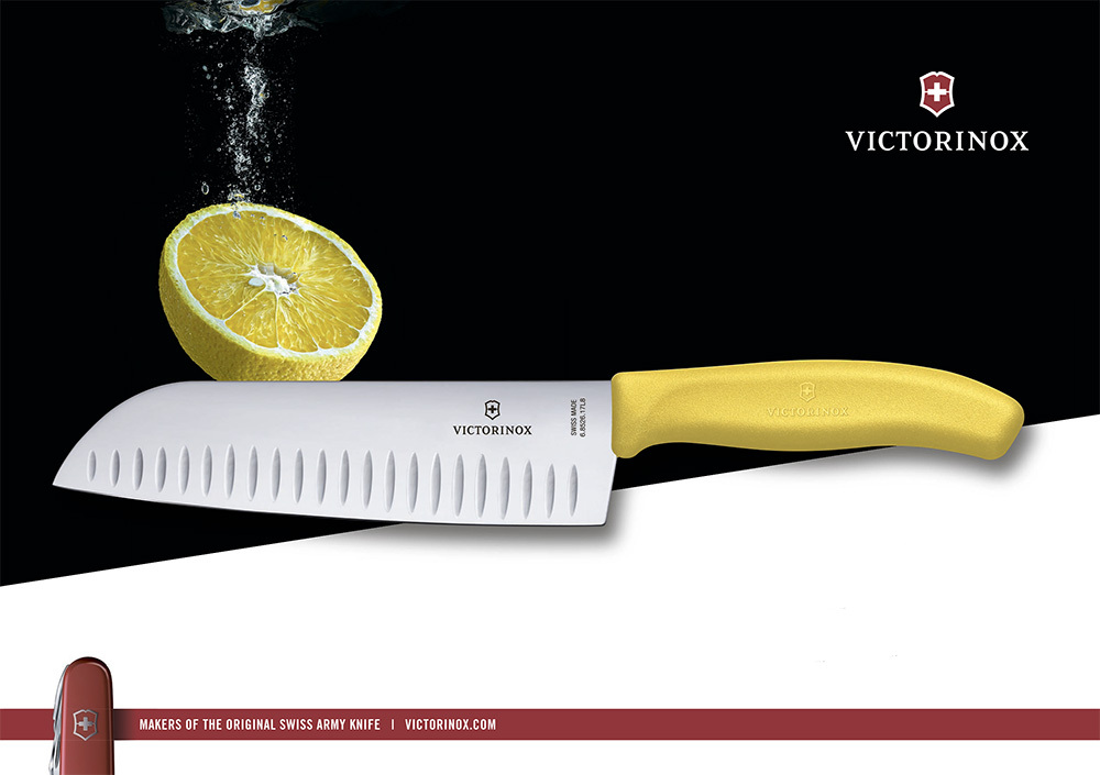 Нож Victorinox "Santoku", лезвие 17 см рифленое, желтый, в картонном блистере Нож Victorinox "Santoku", лезвие 17 см рифленое, желтый, в картонном блистере