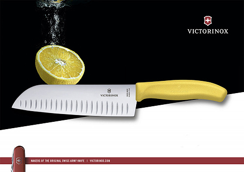 Нож Victorinox "Santoku", лезвие 17 см рифленое, желтый, в картонном блистере Нож Victorinox "Santoku", лезвие 17 см рифленое, желтый, в картонном блистере